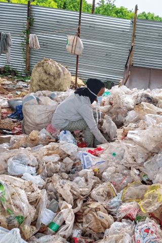 Manual segregation and sorting of dry recyclable waste at the segregation yard